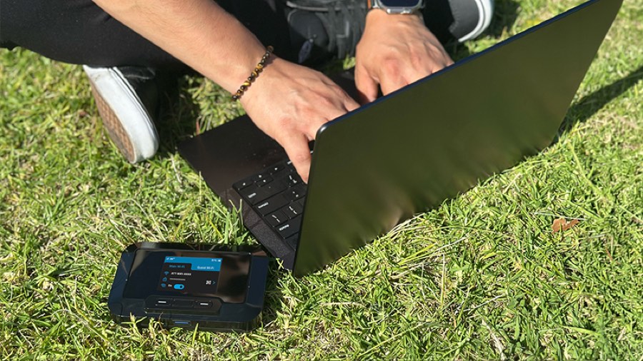 JEXtream mobile hotspot connected to a laptop outdoors